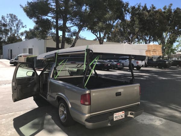 Oversized materials strapped and secured on a flatbed